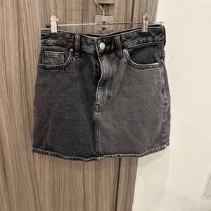 Black denim mini skirt